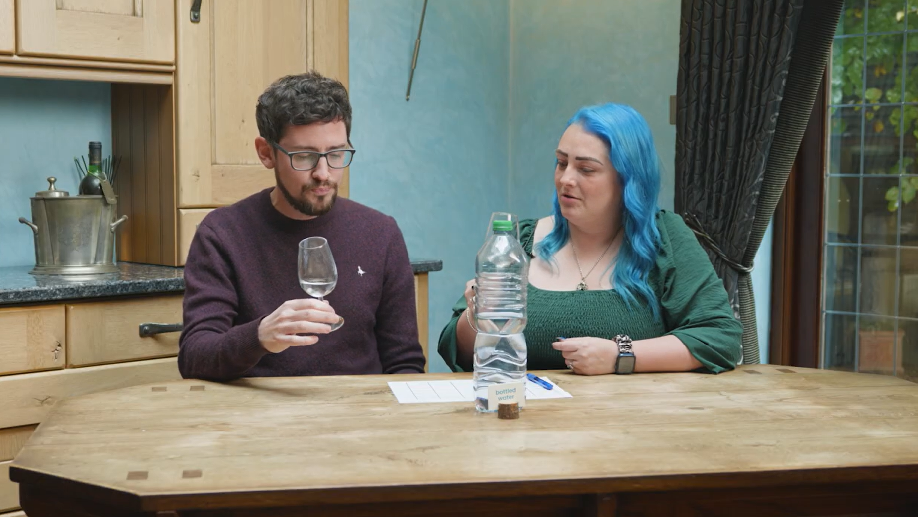 Man and Woman holding glasses of water