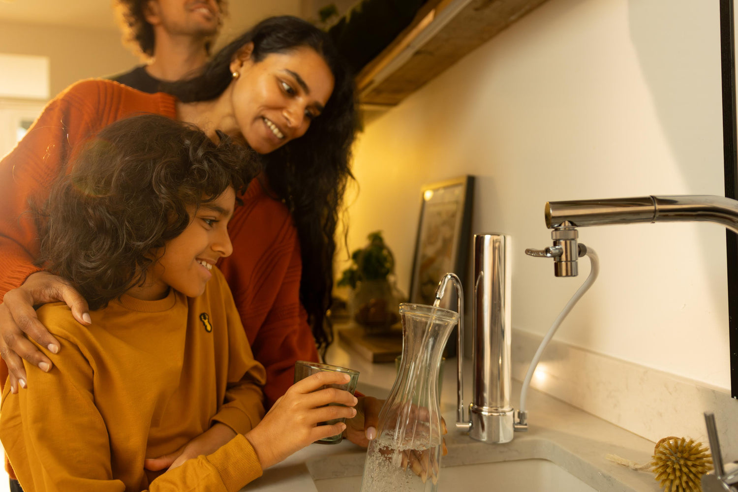 mum helping her son get a glass of water