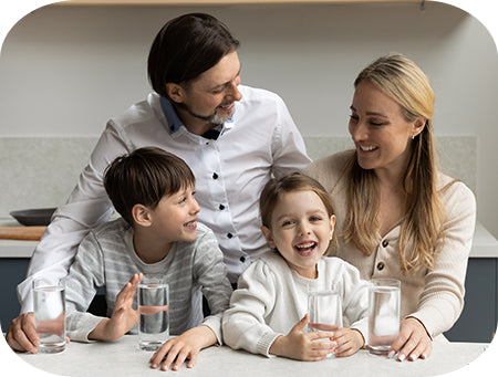 Family enjoying fresh filtered water from a Doulton water filter.