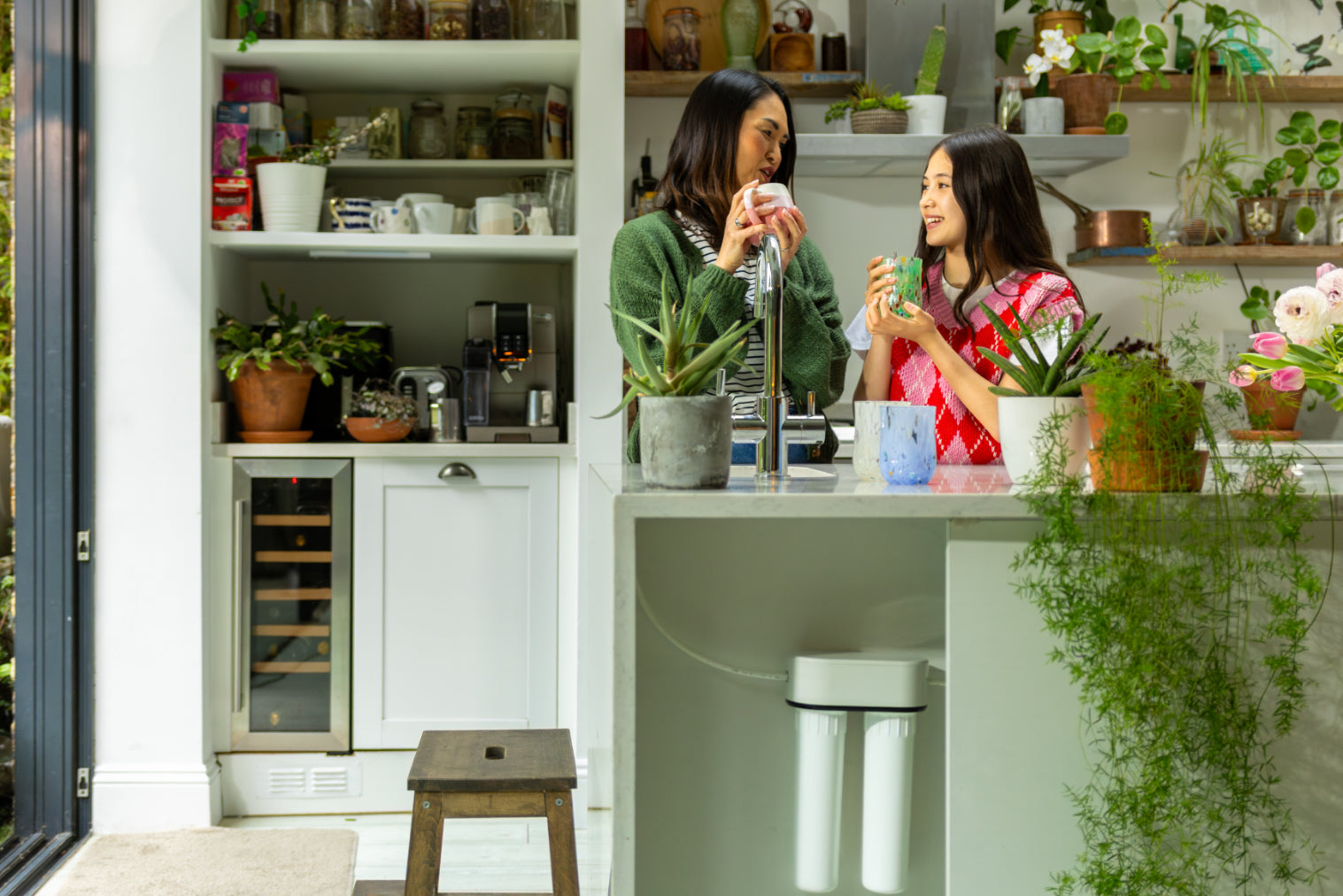  a mum and daughter drinking 