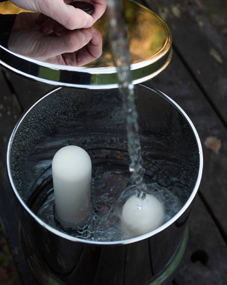 water being poured into gravity system 