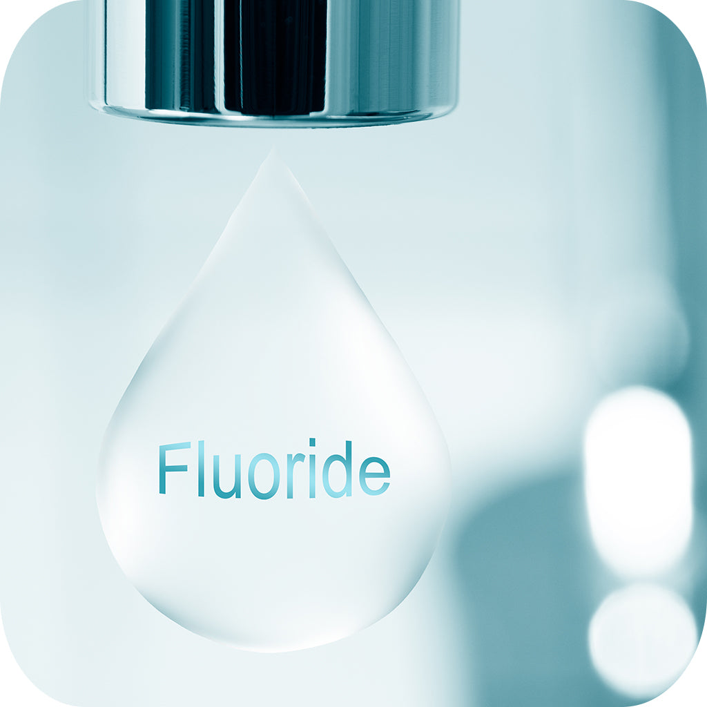 Image depicting tap water with the word 'FLUORIDE' visible.